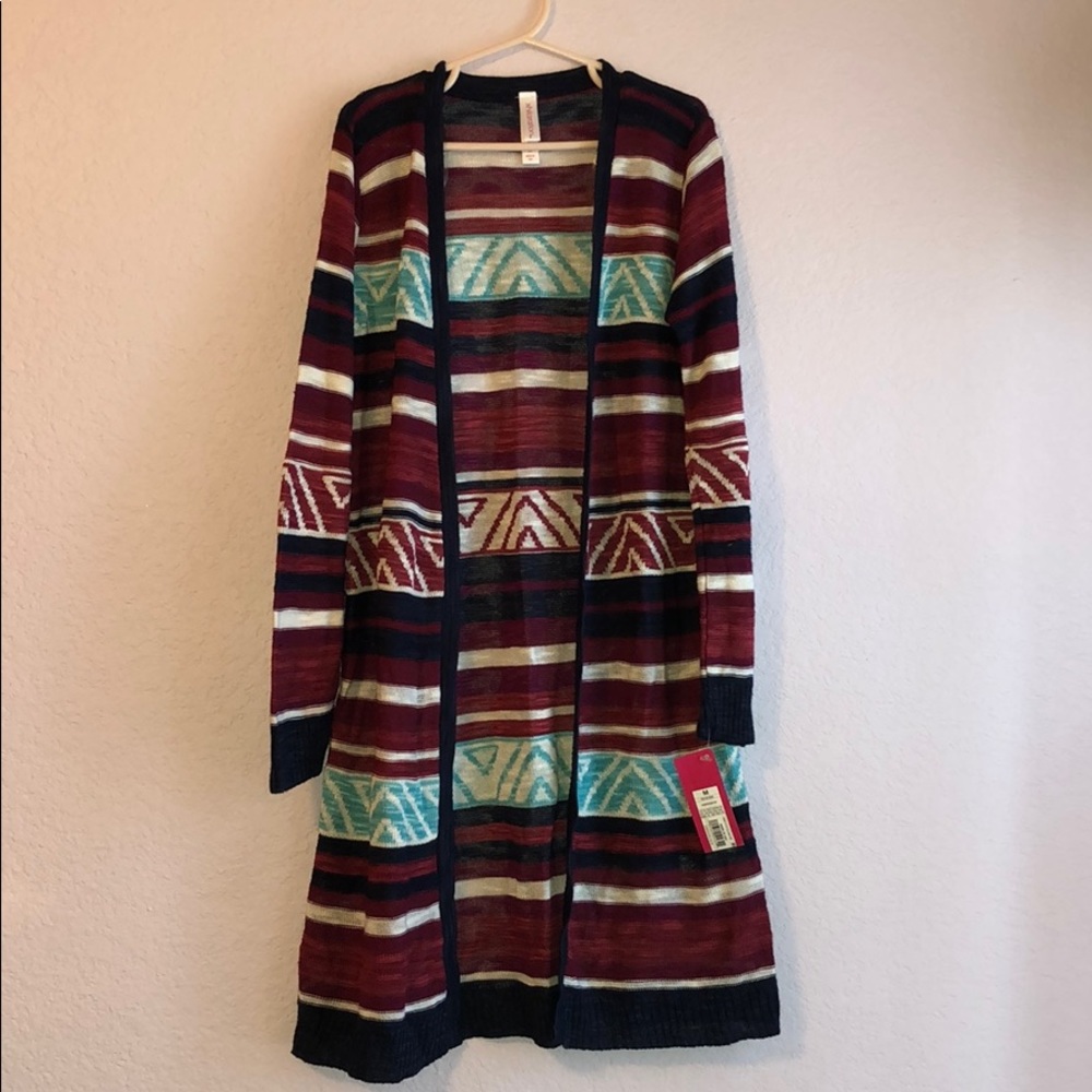 Girls long sweater, cute with jeans, never worn.